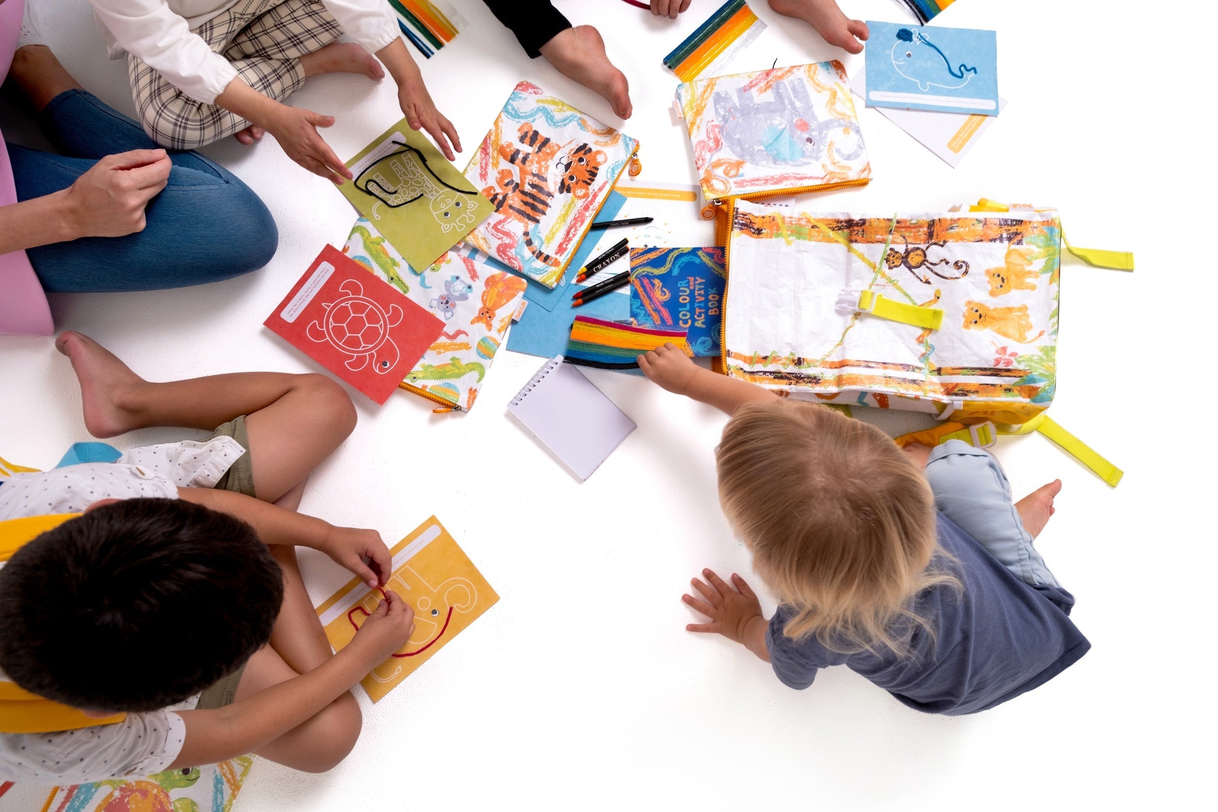 Child playing with colourful Crafty Curls screen-free activity