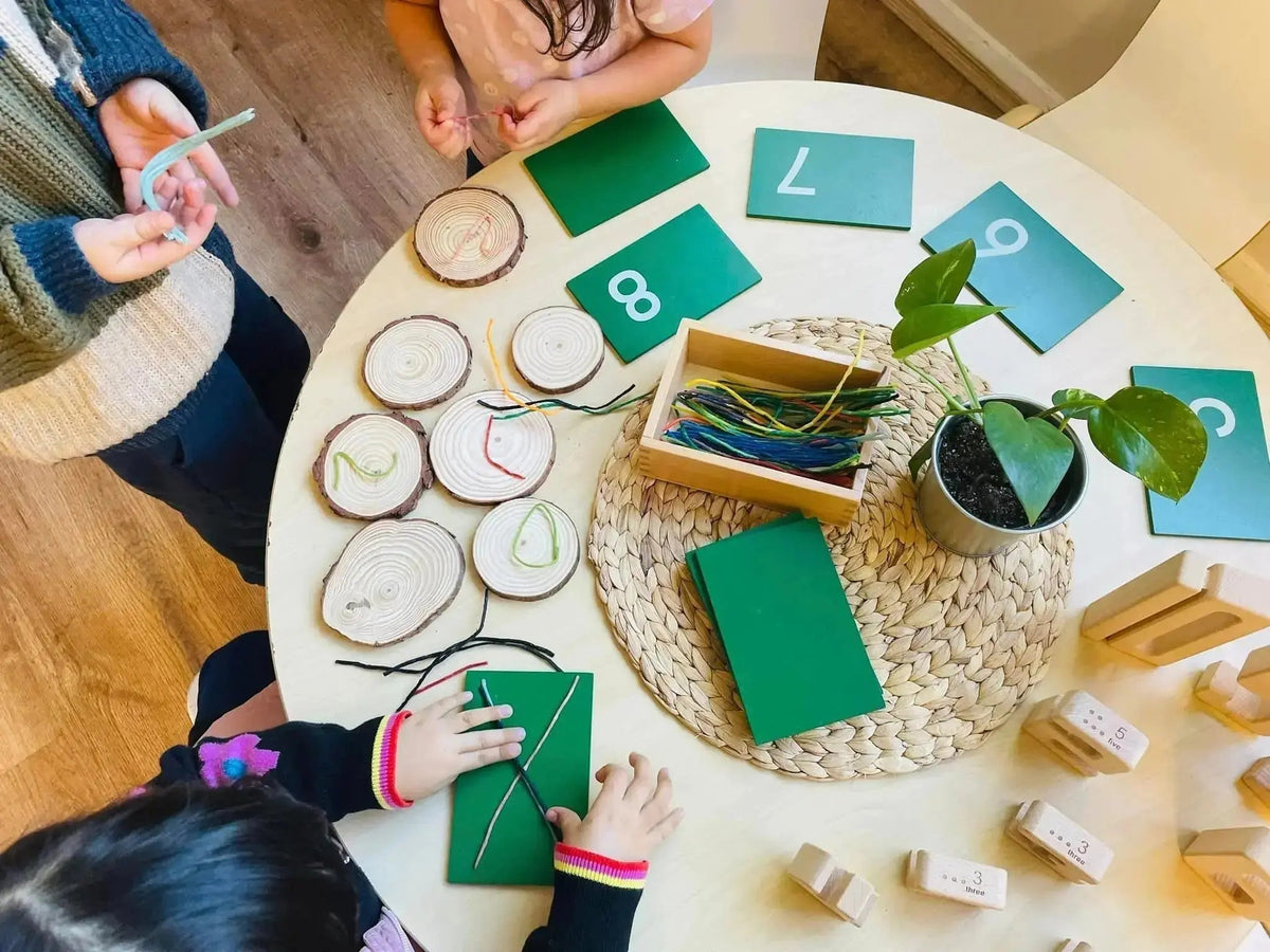 kids are playing with reusable wax sticks Crafty Curls for creative play