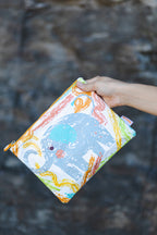 Child using Twisty Kids pencil case to organize wax sticks for travel and creative play