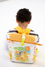Child wearing Twisty Kids backpack with a colorful design of animals and nature on a white background
