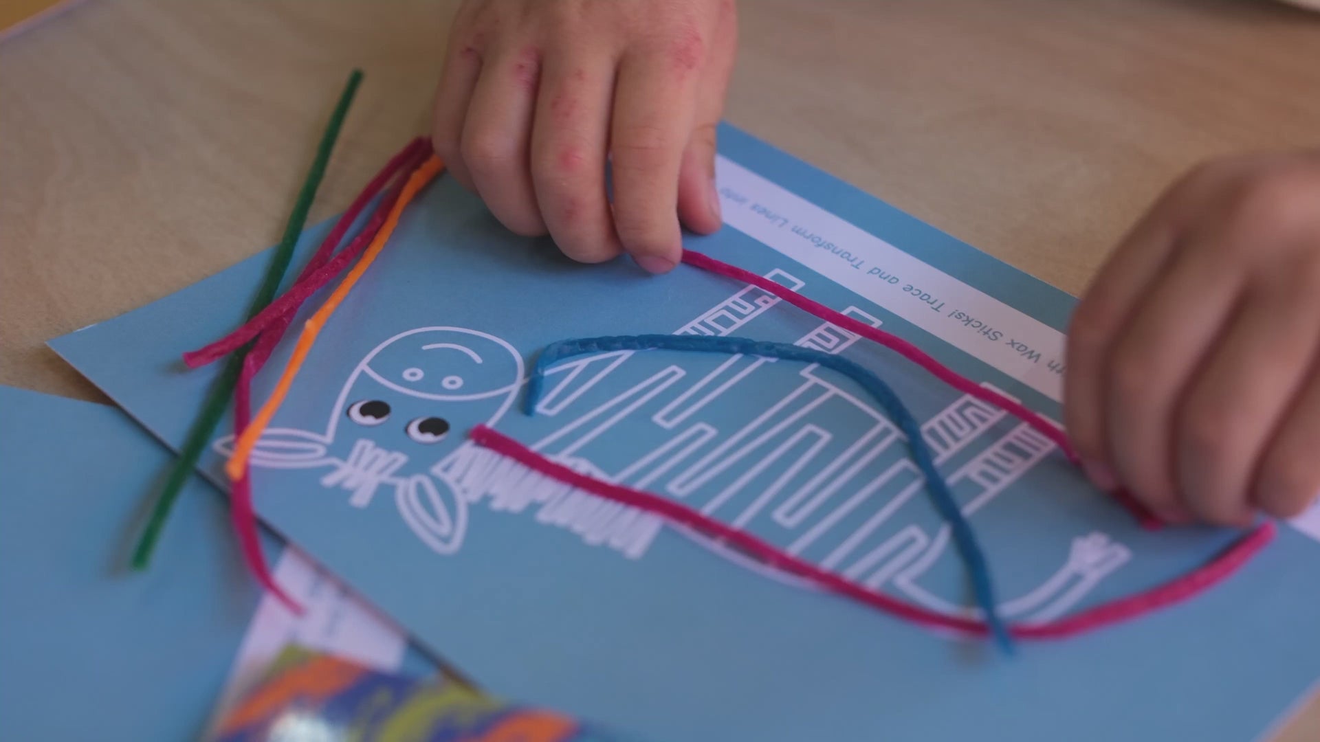Kids crafting and playing with reusable wax sticks for creative play and reducing screen time, creating shapes and characters for screen-free fun and imaginative play