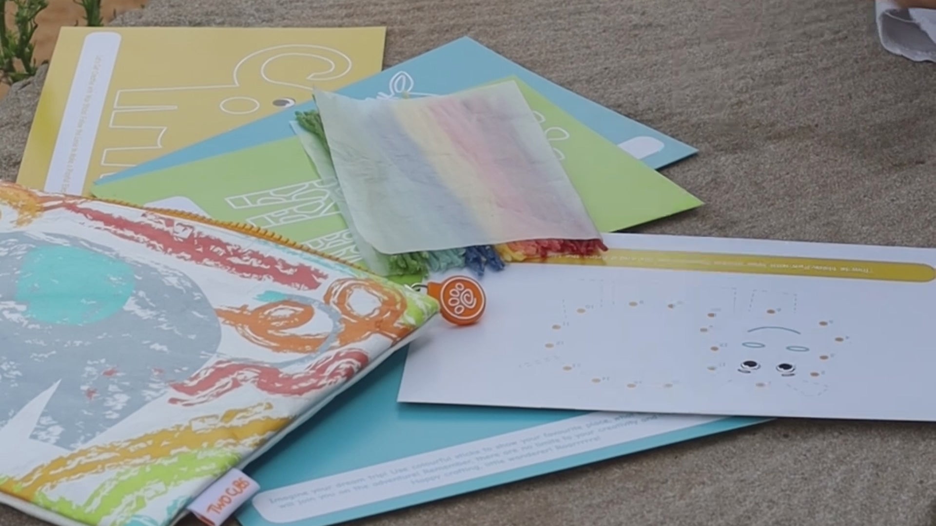 Full contents of the Crafty Curls activity kit, including 60 colorful wax sticks, activity cards, and a reusable storage case for endless creative fun
