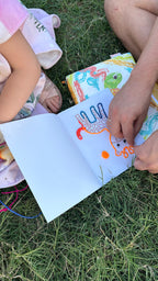 Child developing fine motor skills using colourful wax sticks for hands-on learning activity