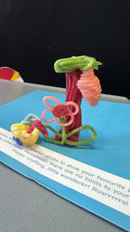 Kids using wax sticks as quiet travel toy on airplane for hands-on learning activity 3