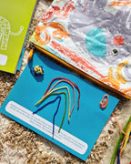 Kid playing with Twisty Kids reusable craft sticks, a quiet screen-free travel toy for creative play
